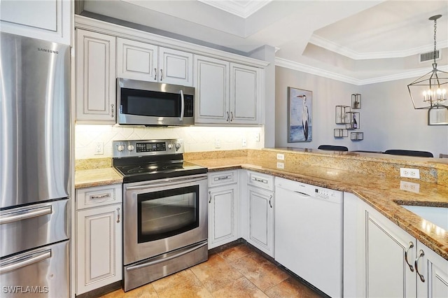 kitchen with kitchen peninsula, stainless steel appliances, pendant lighting, an inviting chandelier, and white cabinets