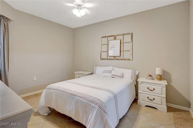 bedroom with light tile patterned floors