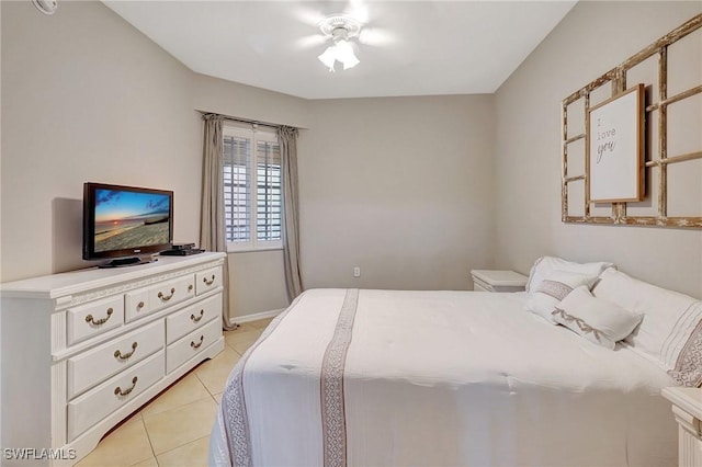 tiled bedroom with ceiling fan