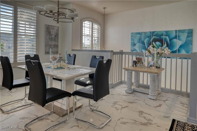 dining area featuring a notable chandelier