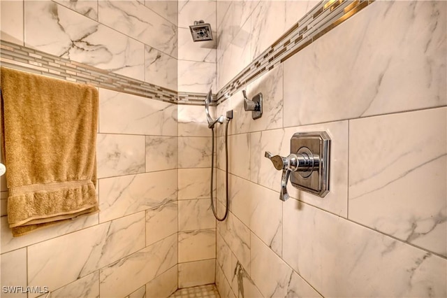 bathroom featuring tiled shower