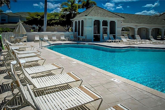 view of swimming pool with a patio area