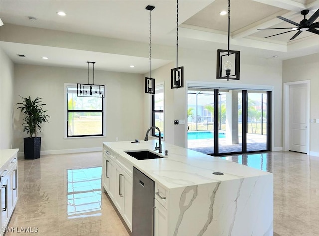 kitchen featuring ceiling fan, sink, a center island with sink, dishwasher, and white cabinetry