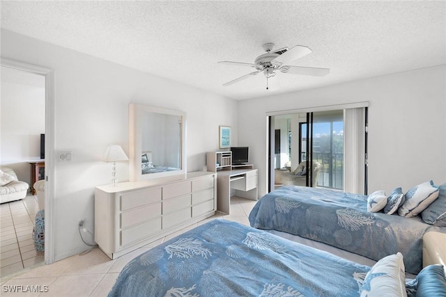 bedroom with ceiling fan, access to outside, light tile patterned flooring, and a textured ceiling