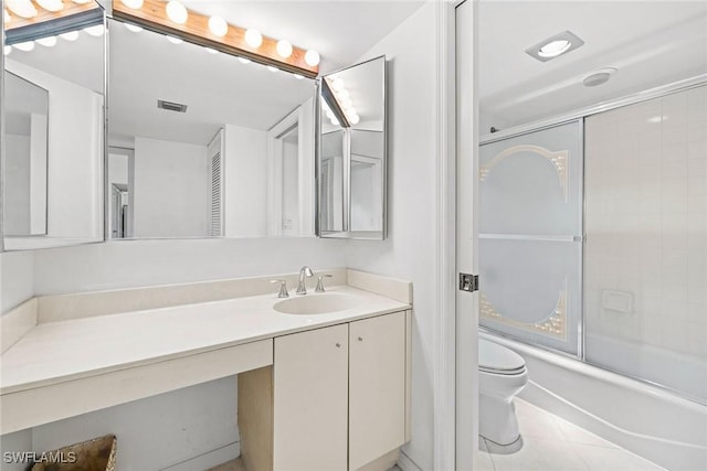 full bath with tile patterned floors, visible vents, toilet, enclosed tub / shower combo, and vanity