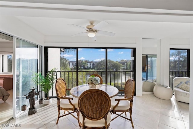 1530 Oyster Catcher Pt Unit 1530C, Naples, FL 34105 - sunroom / solarium featuring tile patterned floors and a water view