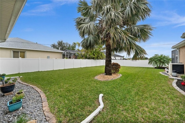 view of yard with a fenced backyard