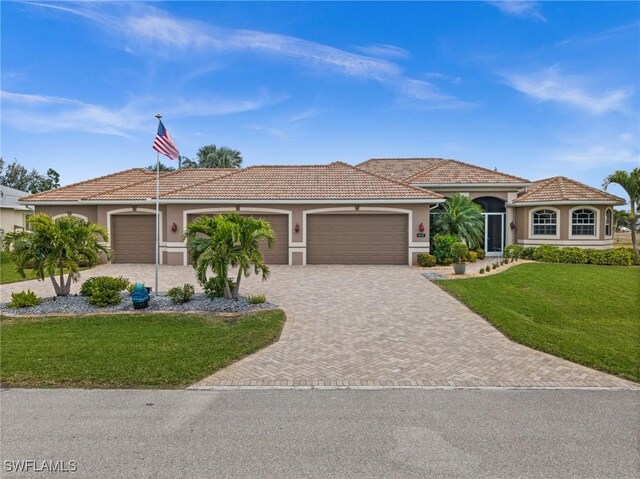 view of front facade with a garage and a front lawn