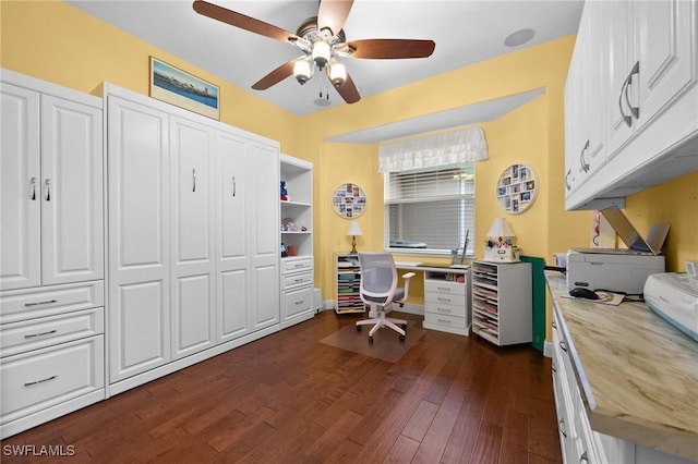 office space featuring dark wood finished floors and a ceiling fan