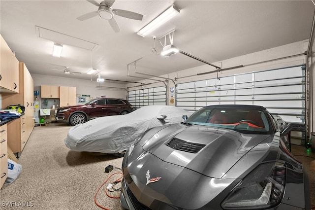 garage featuring a ceiling fan and a garage door opener