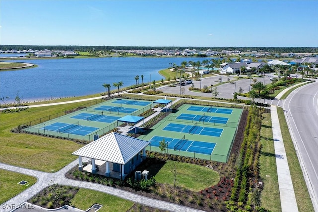 birds eye view of property with a water view