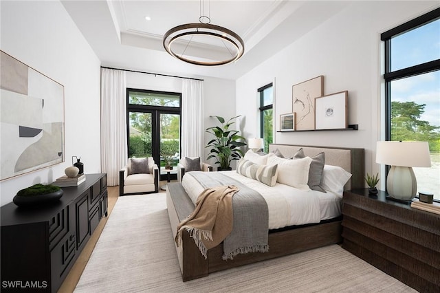 6705 Newport Rd, Naples, FL 34109 - bedroom with multiple windows, a chandelier, and a raised ceiling