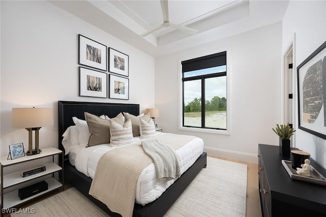 6705 Newport Rd, Naples, FL 34109 - bedroom featuring baseboards, a tray ceiling, light wood-type flooring, and a ceiling fan