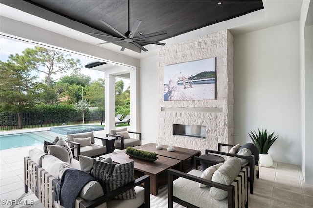 6705 Newport Rd, Naples, FL 34109 - view of patio / terrace featuring a ceiling fan, fence, an outdoor living space with a fireplace, and outdoor dining space