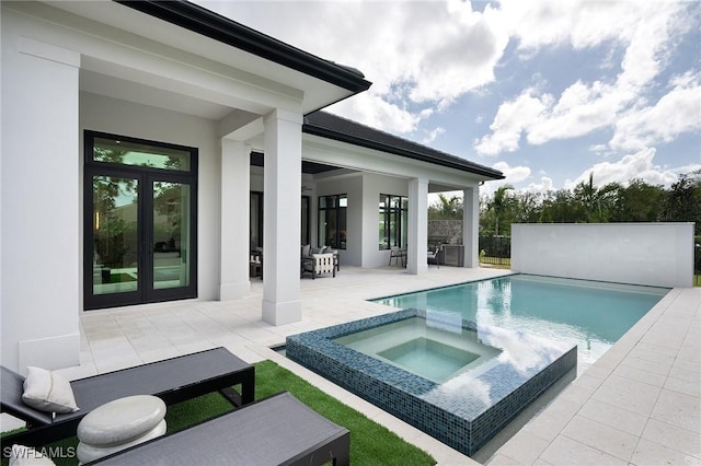 6705 Newport Rd, Naples, FL 34109 - view of swimming pool featuring a patio, french doors, a pool with connected hot tub, and an outdoor hangout area
