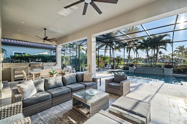 view of patio / terrace featuring ceiling fan, a lanai, and an outdoor living space with a fireplace