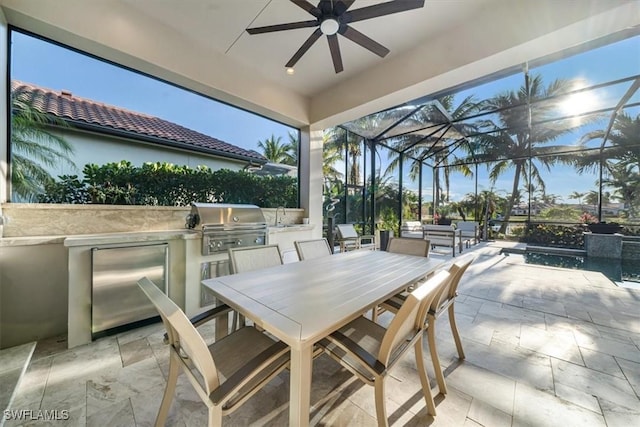 view of patio with glass enclosure, exterior kitchen, and outdoor lounge area