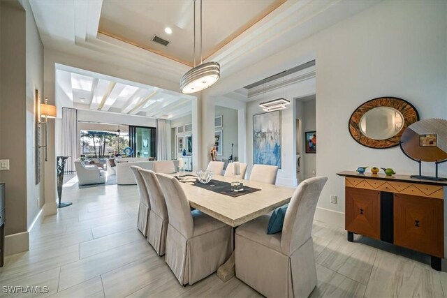 dining room featuring a tray ceiling