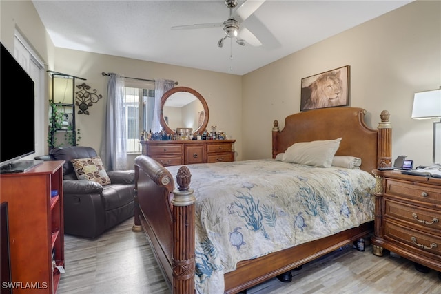 bedroom with ceiling fan and light hardwood / wood-style flooring