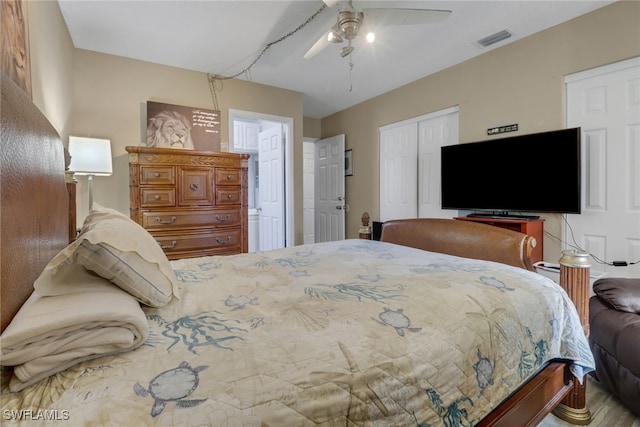 bedroom featuring ceiling fan, a closet, and visible vents