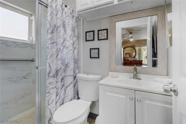 bathroom featuring a shower with curtain, vanity, and toilet