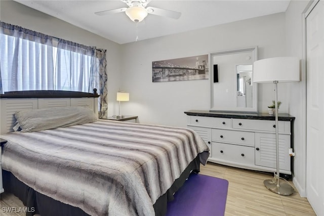 bedroom featuring ceiling fan and light hardwood / wood-style flooring