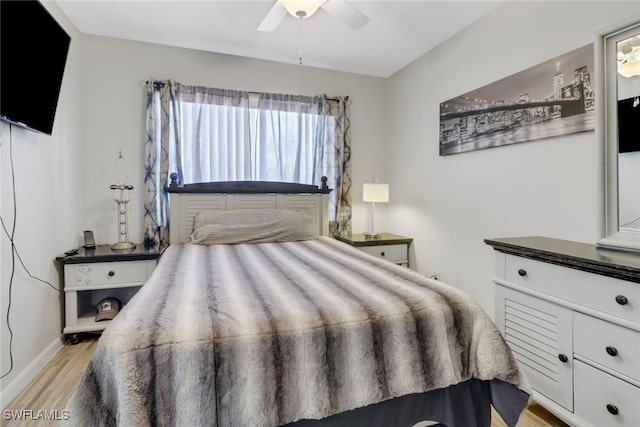 bedroom featuring ceiling fan and light hardwood / wood-style floors