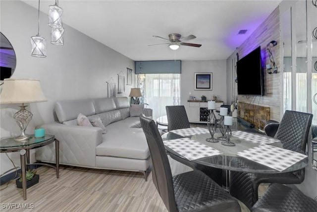 dining room featuring light wood-type flooring and ceiling fan