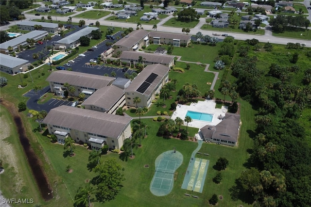 birds eye view of property with a residential view