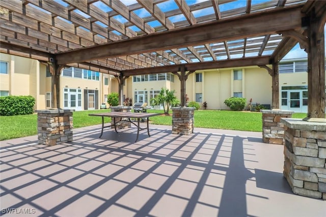 view of patio / terrace with a pergola and outdoor dining space