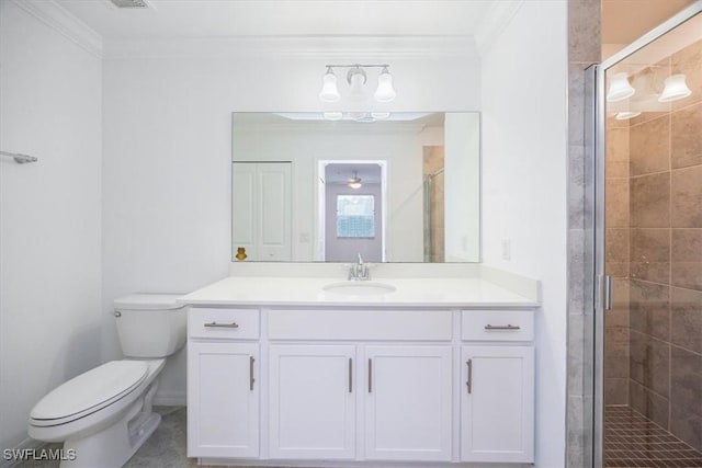 full bathroom with ornamental molding, a shower stall, toilet, and vanity