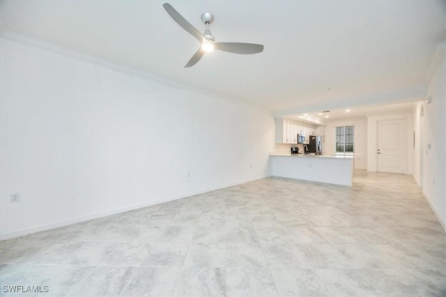 unfurnished living room featuring ceiling fan and crown molding