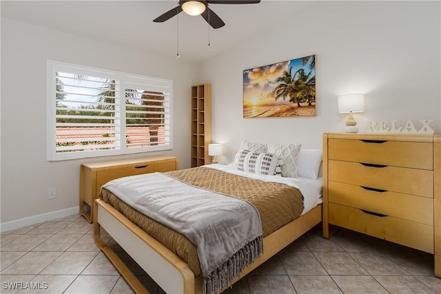 6750 Beach Resort Dr Unit 10, Naples, FL 34114 - bedroom with baseboards, light tile patterned floors, and ceiling fan
