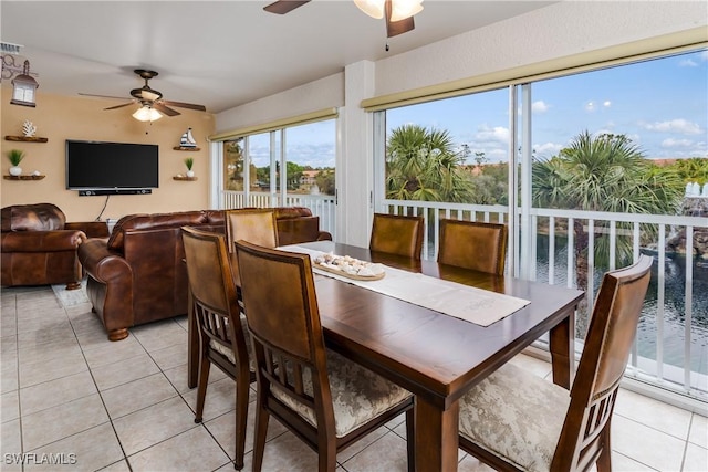 6750 Beach Resort Dr Unit 10, Naples, FL 34114 - dining room with visible vents, light tile patterned floors, and ceiling fan