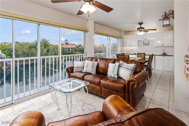 6750 Beach Resort Dr Unit 10, Naples, FL 34114 - living room featuring light tile patterned floors and ceiling fan