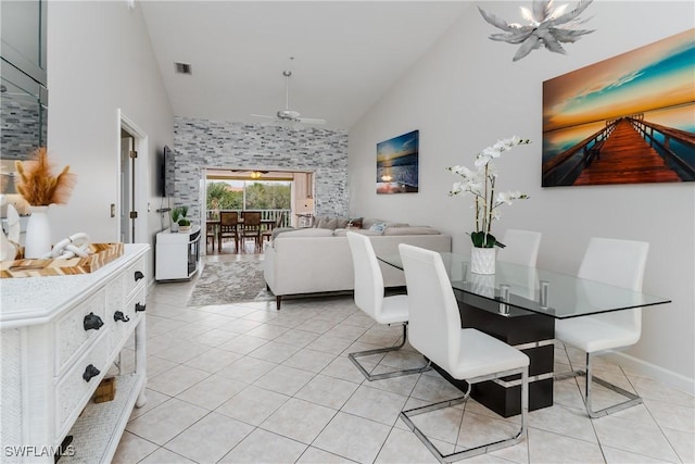 6750 Beach Resort Dr Unit 10, Naples, FL 34114 - dining area with light tile patterned floors, a ceiling fan, high vaulted ceiling, and visible vents