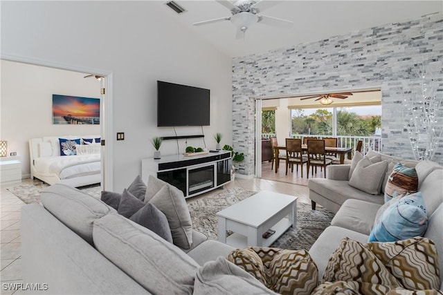 6750 Beach Resort Dr Unit 10, Naples, FL 34114 - tiled living area featuring baseboards, visible vents, a ceiling fan, and high vaulted ceiling