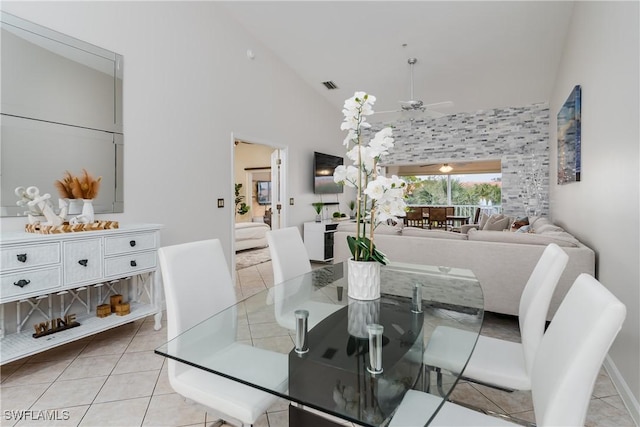 6750 Beach Resort Dr Unit 10, Naples, FL 34114 - dining room featuring light tile patterned flooring, ceiling fan, high vaulted ceiling, and visible vents
