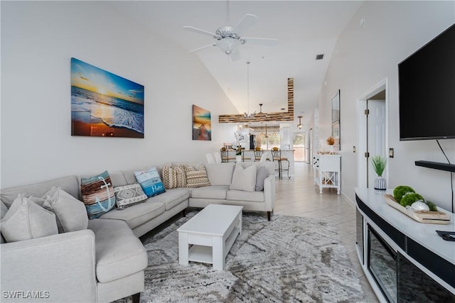 6750 Beach Resort Dr Unit 10, Naples, FL 34114 - living area with high vaulted ceiling, ceiling fan, and light tile patterned flooring