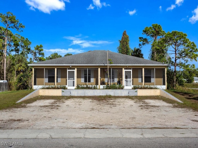 view of front of property featuring a sunroom