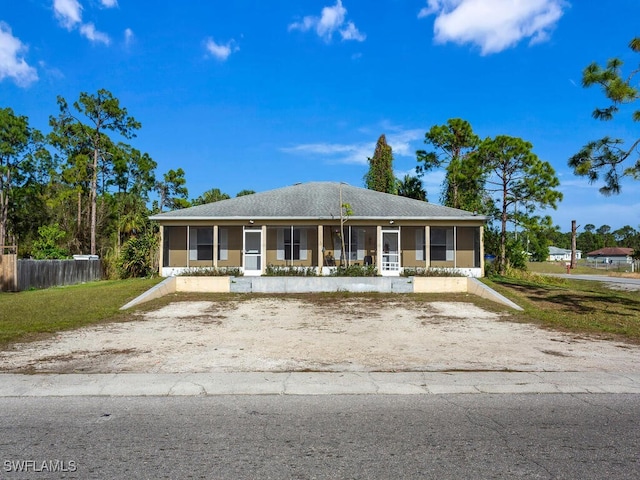 view of front of house with a sunroom