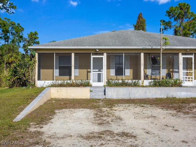 view of front of property with a sunroom