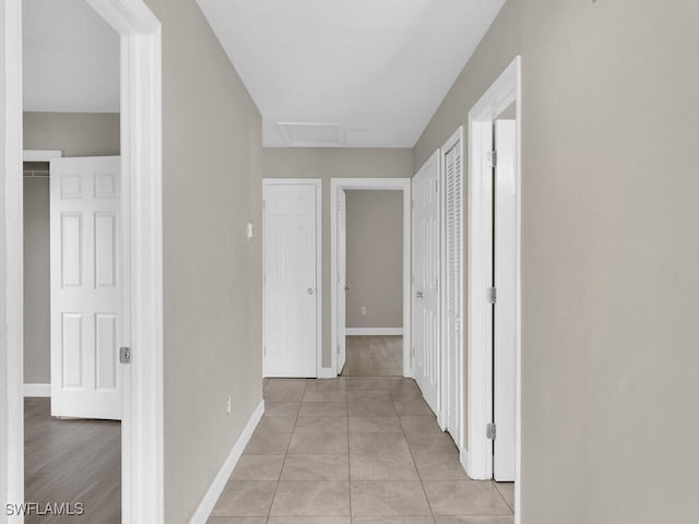 hallway with light tile patterned floors