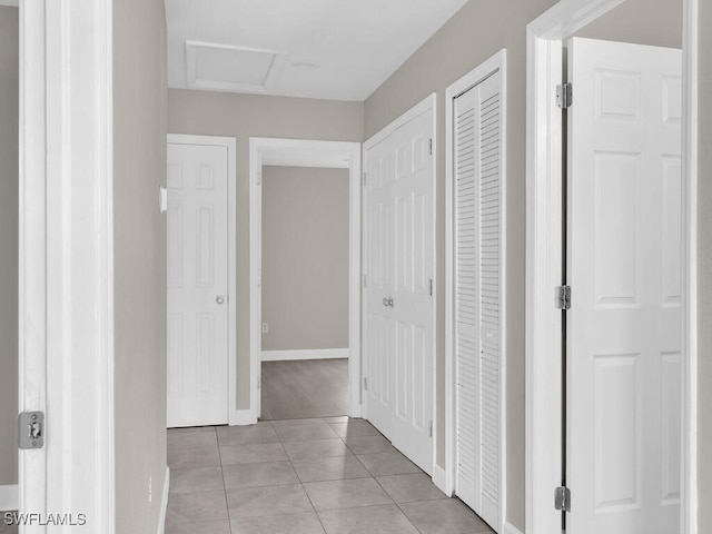 hallway with light tile patterned flooring