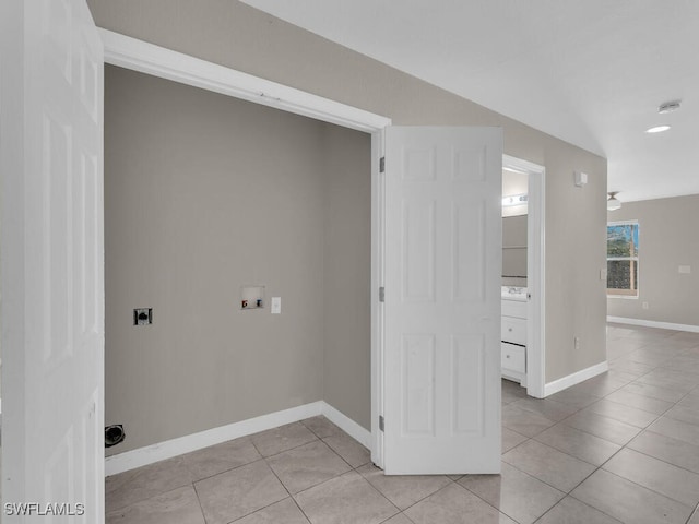 laundry room with electric dryer hookup, hookup for a washing machine, and light tile patterned flooring