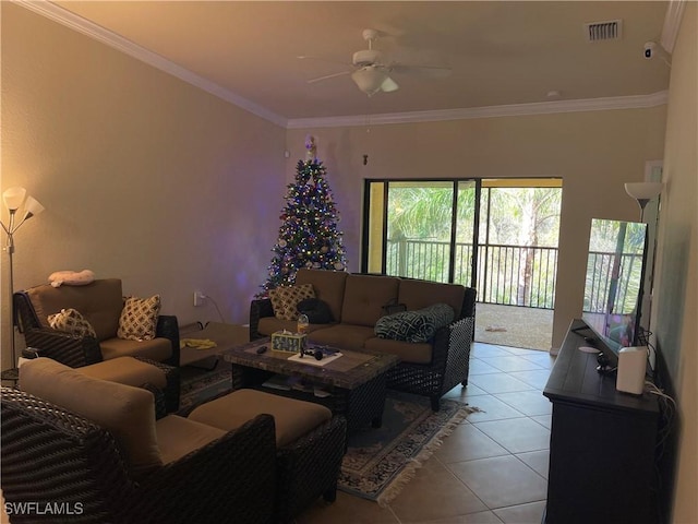 living room featuring ceiling fan, light tile patterned floors, and crown molding