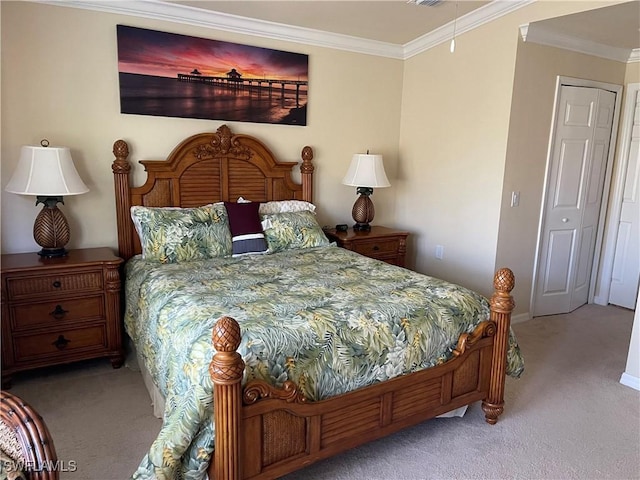 bedroom featuring light colored carpet, a closet, and crown molding