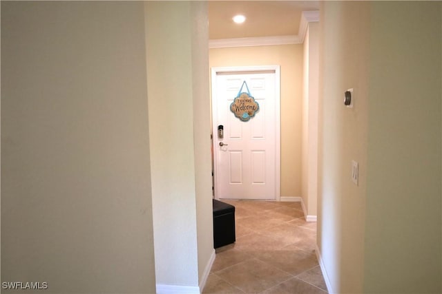 corridor featuring ornamental molding, recessed lighting, light tile patterned floors, and baseboards