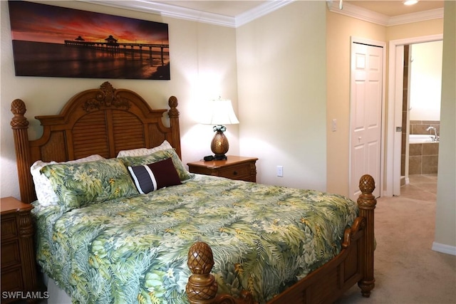 bedroom with connected bathroom, crown molding, and carpet floors