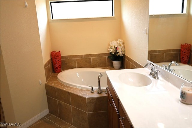 full bathroom with a garden tub and vanity